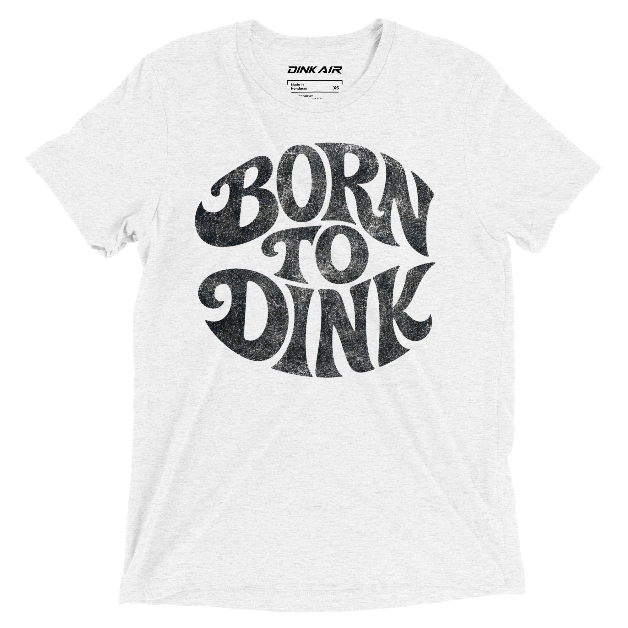 White tri-blend t-shirt featuring a bold vintage-inspired "Born to Dink" graphic across the front in black, designed for pickleball players with a retro athletic style.