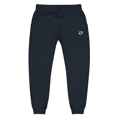 Front view of the Classic Performance Joggers in navy featuring lightweight performance fabric, an embroidered white D Mark logo on the upper left thigh, elastic waistband with drawstring, tapered athletic fit, ribbed ankle cuffs, side pockets, and a minimalist design for pickleball, training, travel, recovery, and everyday wear.