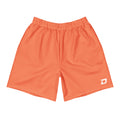 Front view of the Coral Performance Shorts featuring a solid coral performance fabric, a white D Mark logo on the lower left leg, elastic waistband, athletic fit, moisture-wicking material, and a clean minimalist design for pickleball, training, tournaments, and everyday wear.