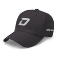 Angled front view of the dark gray D Mark Classic pickleball cap featuring a white embroidered D Mark logo on the front, an embroidered Dink Air Signature logo on the left side, and a curved brim.
