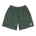 Front view of the Drift Performance Shorts featuring a deep forest green performance fabric, white D Mark logo on the lower left leg, elastic waistband, athletic fit, moisture-wicking material, lightweight four-way stretch construction, and a clean minimalist design built for pickleball, tournaments, training, travel, and everyday wear.