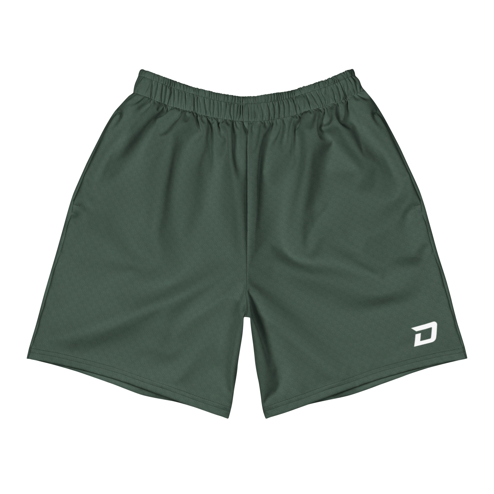 Front view of the Drift Performance Shorts featuring a deep forest green performance fabric, white D Mark logo on the lower left leg, elastic waistband, athletic fit, moisture-wicking material, lightweight four-way stretch construction, and a clean minimalist design built for pickleball, tournaments, training, travel, and everyday wear.