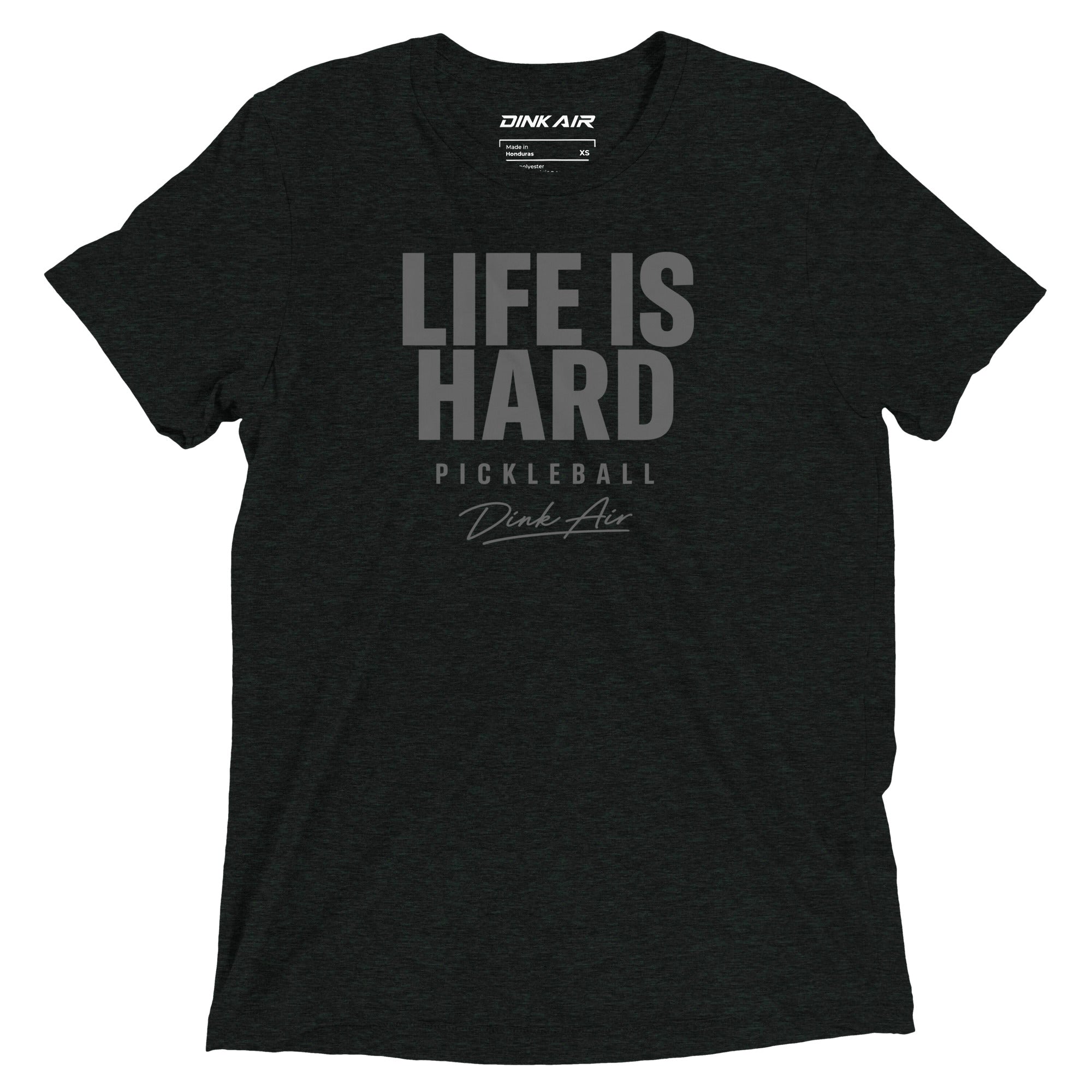 Charcoal black tri-blend t-shirt featuring a bold tonal "Life Is Hard" graphic with "Pickleball" and Dink Air signature script across the front.
