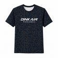 Front view of the Dink Air Midnight Performance Tee featuring a dark navy and charcoal tonal pattern with a white Signature Pickleball logo across the chest.