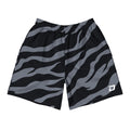 Front view of Dink Air Stealth Performance Shorts featuring a bold black and charcoal stripe pattern with a white D Mark logo on the lower left leg. Premium pickleball performance shorts designed for unrestricted movement, comfort, and everyday wear.